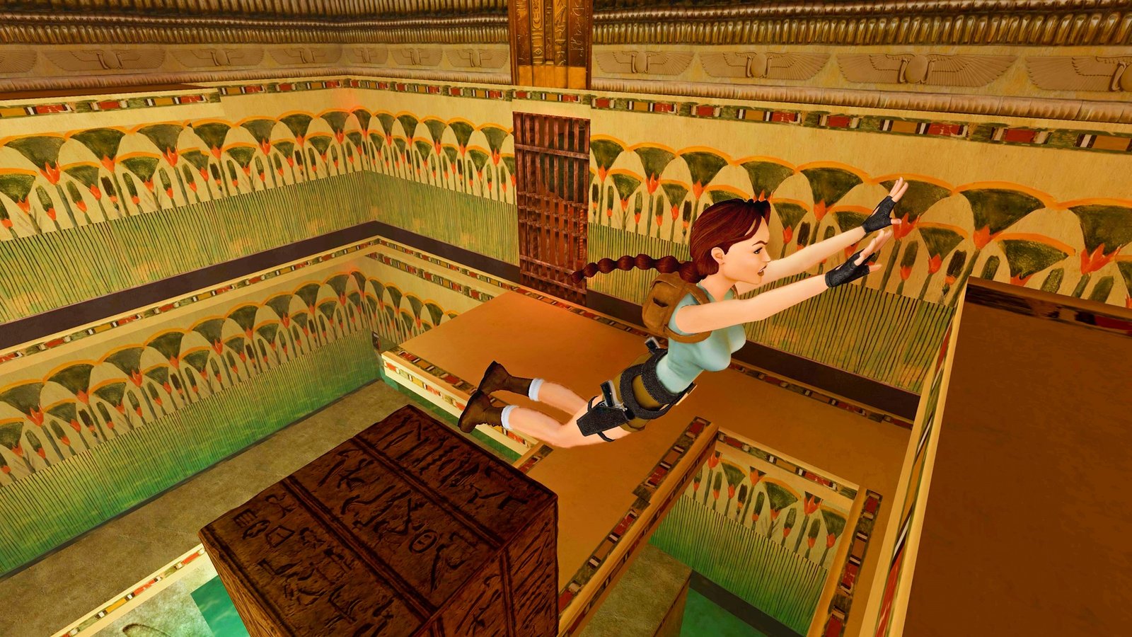 Laura jumping to a ramp inside a tomb