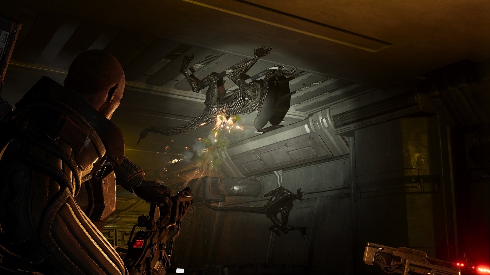 Marine shooting Aliens on the roof inside a corridor